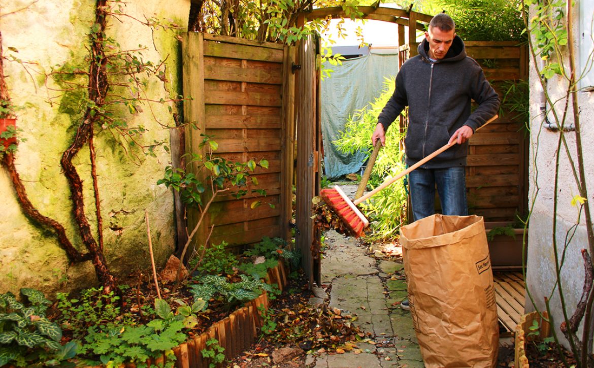 Man,Taking,Care,Of,His,Garden,By,Picking,Up,Dead
